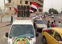 به اهتزاز درآمدن پرچم ایران در خیابان های بغداد+تصاویر